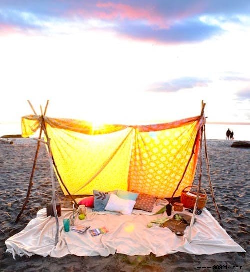 Poles + Old Sheet =A Gorgeous Bohemian Beach Tent! 