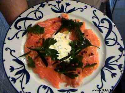 Raw salmon with olive oil, ginger and pink berries, dill cream, Guérande salt 