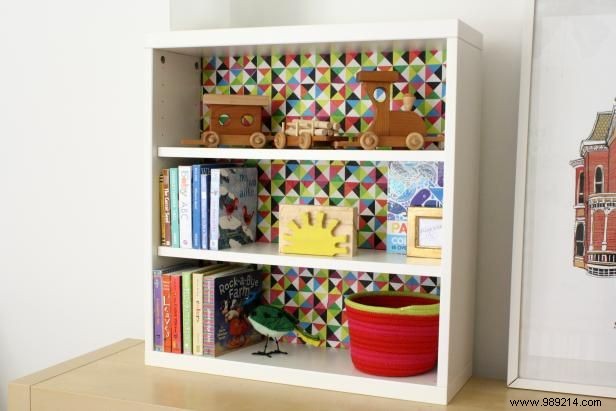 How to decoupage paper on the back of a shelf