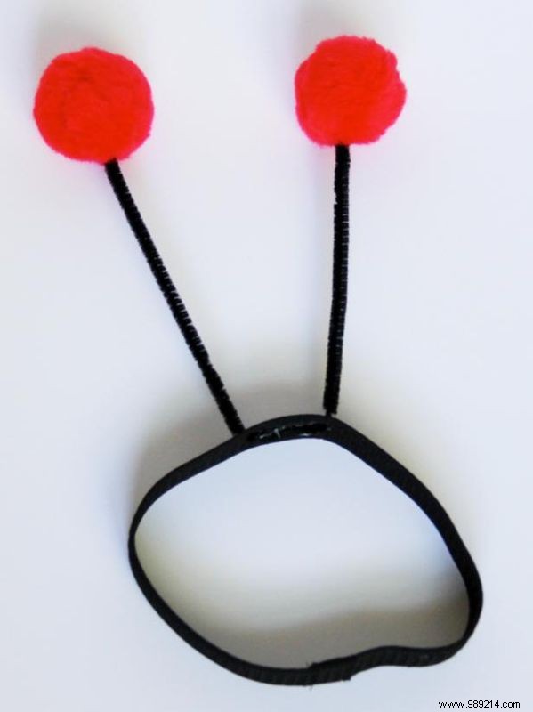 Make a ladybug fancy dress costume for a dog.