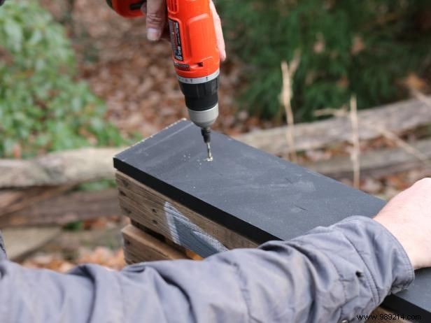 Use a shipping pallet to create outdoor patio art or a custom sign